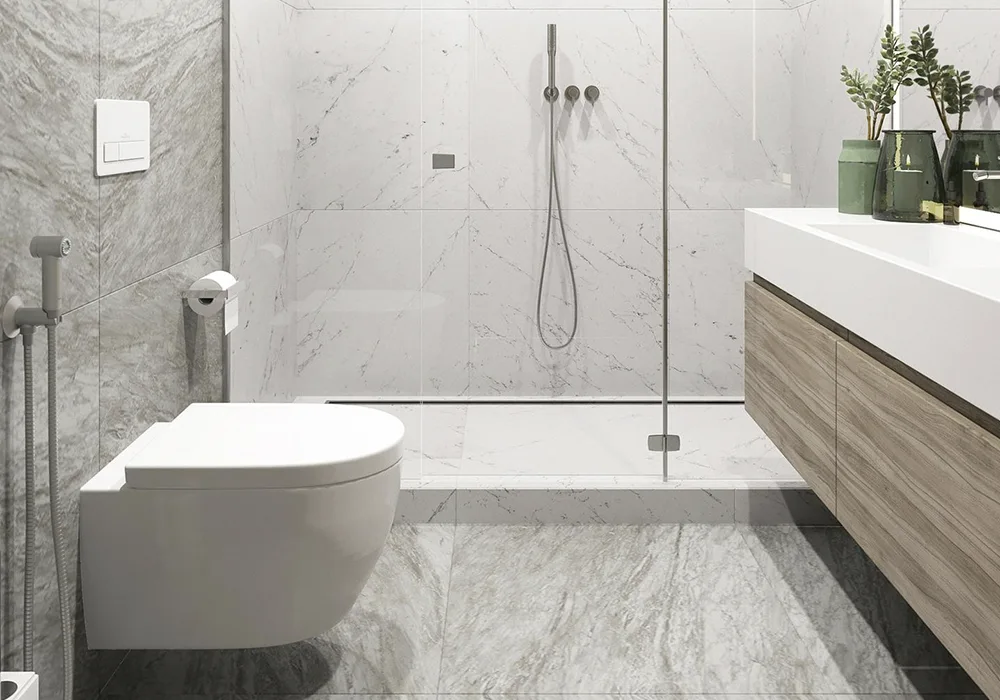 Modern bathroom with marble tiles, floating vanity and frameless glass shower