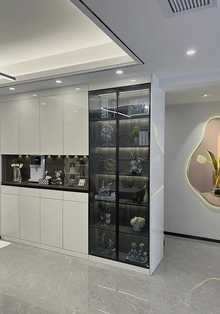 Modern living room with custom white cabinet, glass display shelves, and LED accent lighting.